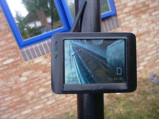 An image showing a gutter being cleaned on a screen