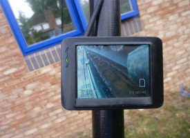 An image showing a gutter being cleaned on a screen