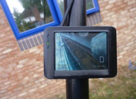 An image showing a gutter being cleaned on a screen
